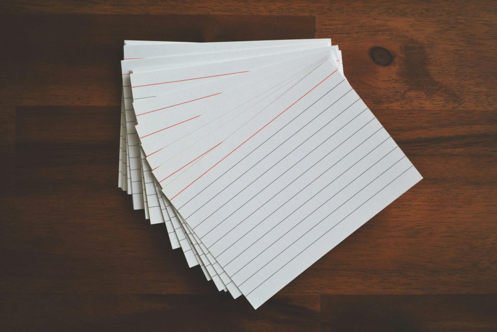 Picture white ruled paper lot on brown wooden surface